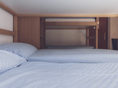 Mehrbettzimmer mit Doppelstockbetten | © Davos Klosters Mountains 