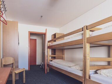 Mehrbettzimmer mit Stockbetten | © Davos Klosters Mountains