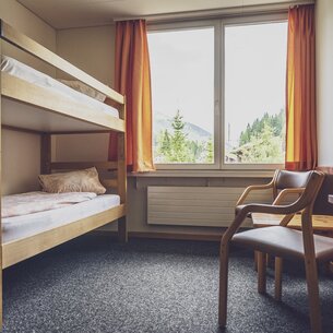 Mehrbettzimmer mit Stockbetten | © Davos Klosters Mountains