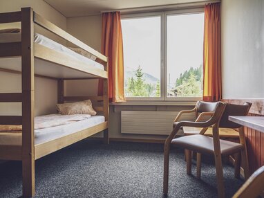 Mehrbettzimmer mit Stockbetten | © Davos Klosters Mountains